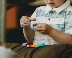 boy playing with legos