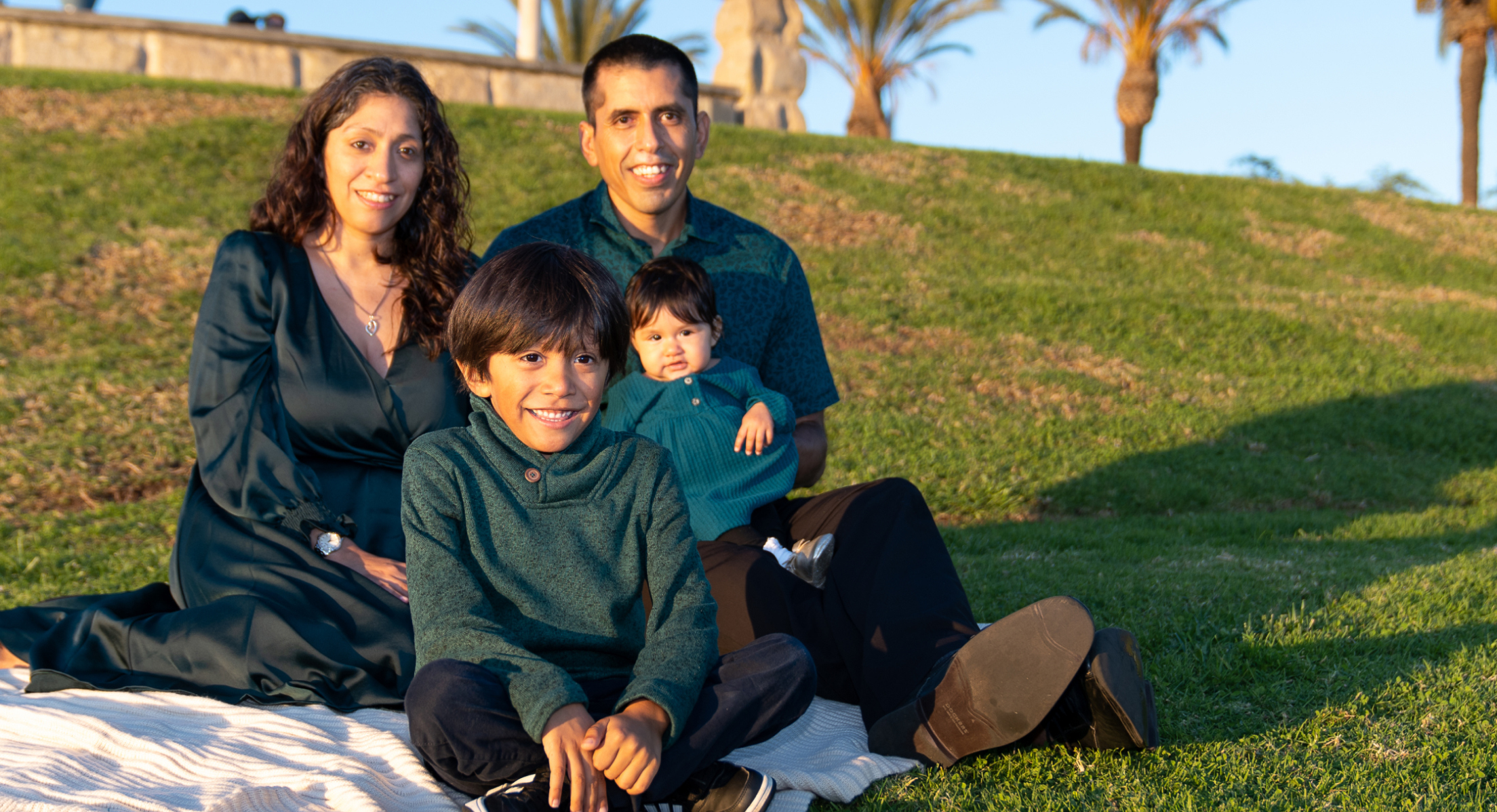 happy hispanic family photo in a park